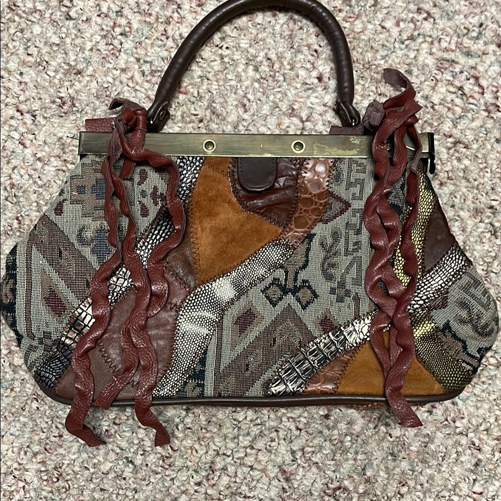 Vintage 80s patchwork leather fringe and metal clip close top handle purse